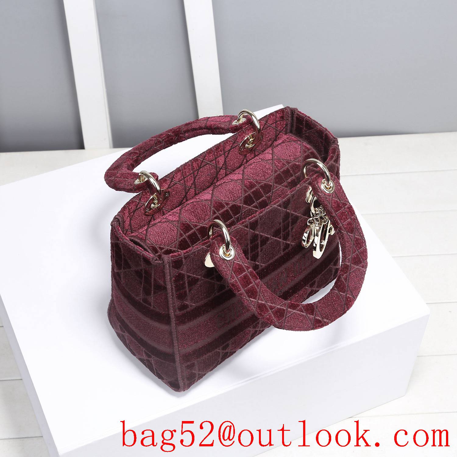 Dior Five panels of burgundy velvet embroidered cannage pattern throughout winered tote bag