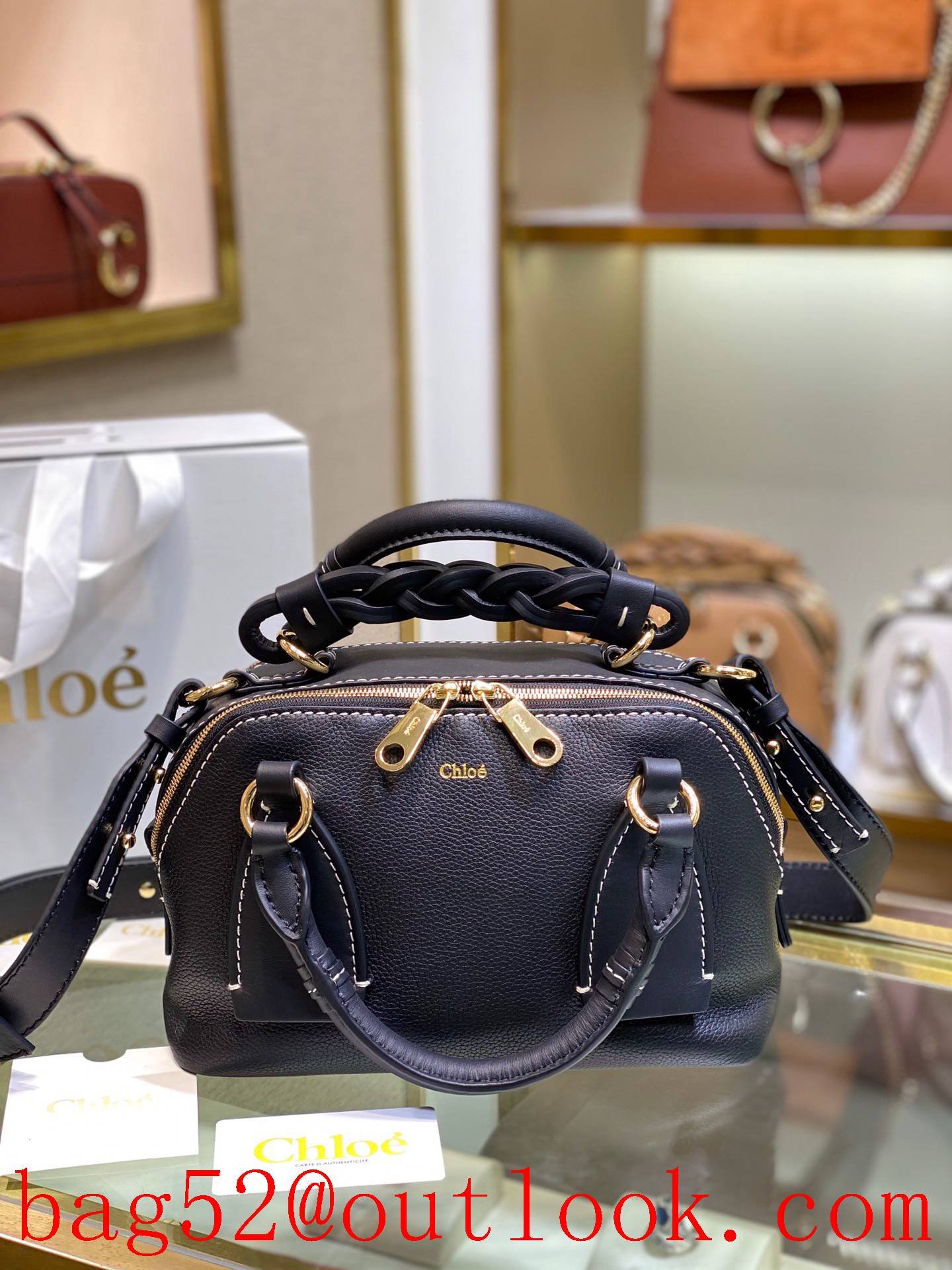 Chole black daria ye-catching double zipper design copper-gold-plated handbag